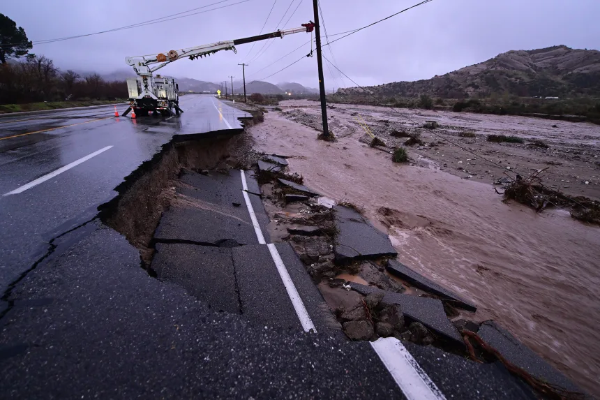 Part of California State Route 138 washes away from flooding Wednesday, outside of Wrightwood, California