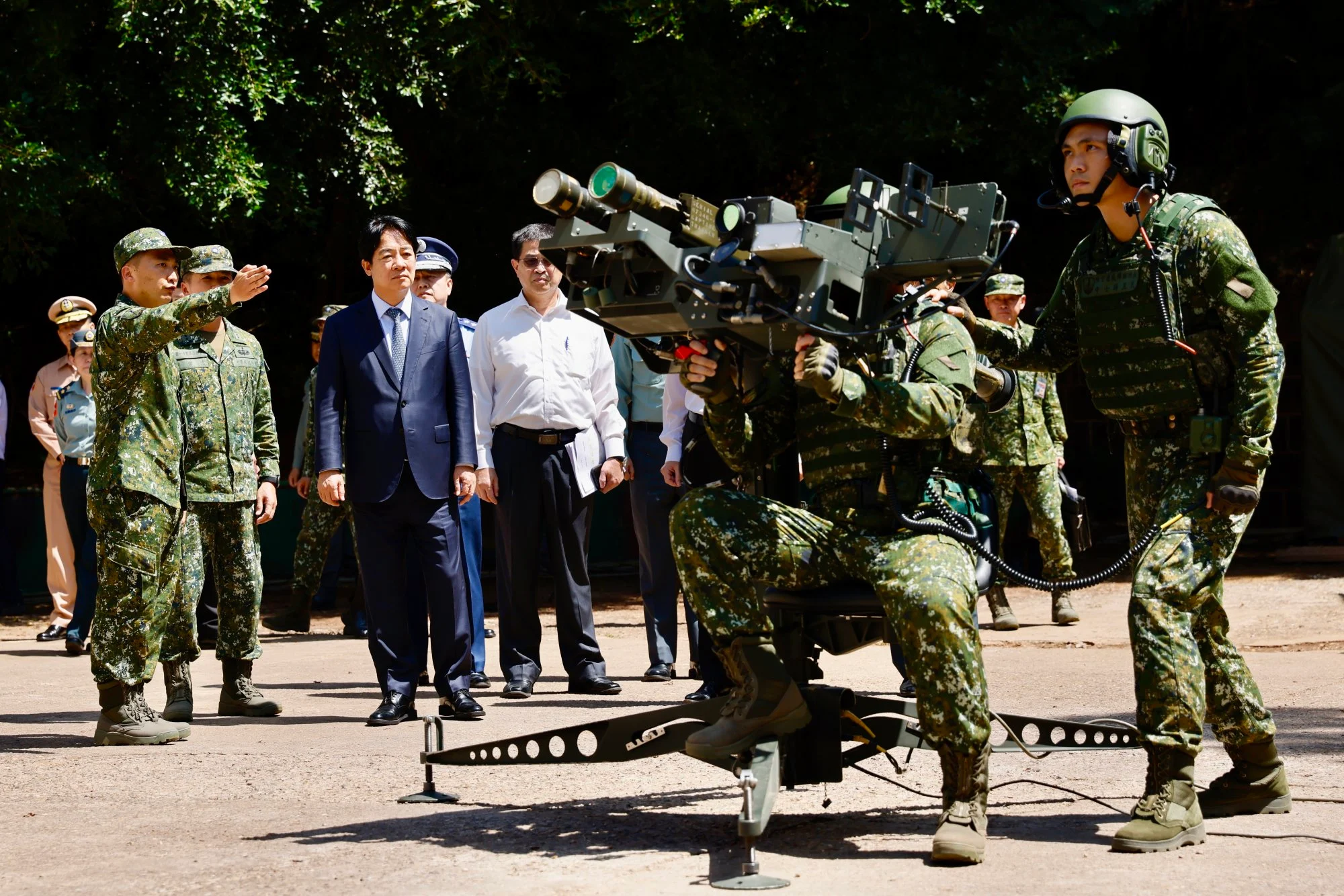 Taiwan President Lai Ching-te (4th left) watches a demonstration of a US-made Dual Mount Stinger air-defence system during a visit to inspect military troops on Penghu Islands