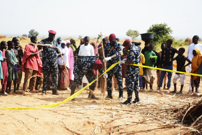 Nigeria police, Anti-Bomb squad, secure the scene of a U.S. airstrike in Northwest, Jabo, Nigeria